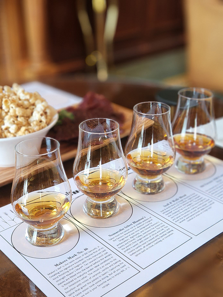 Bourbon and popcorn by a fireplace
