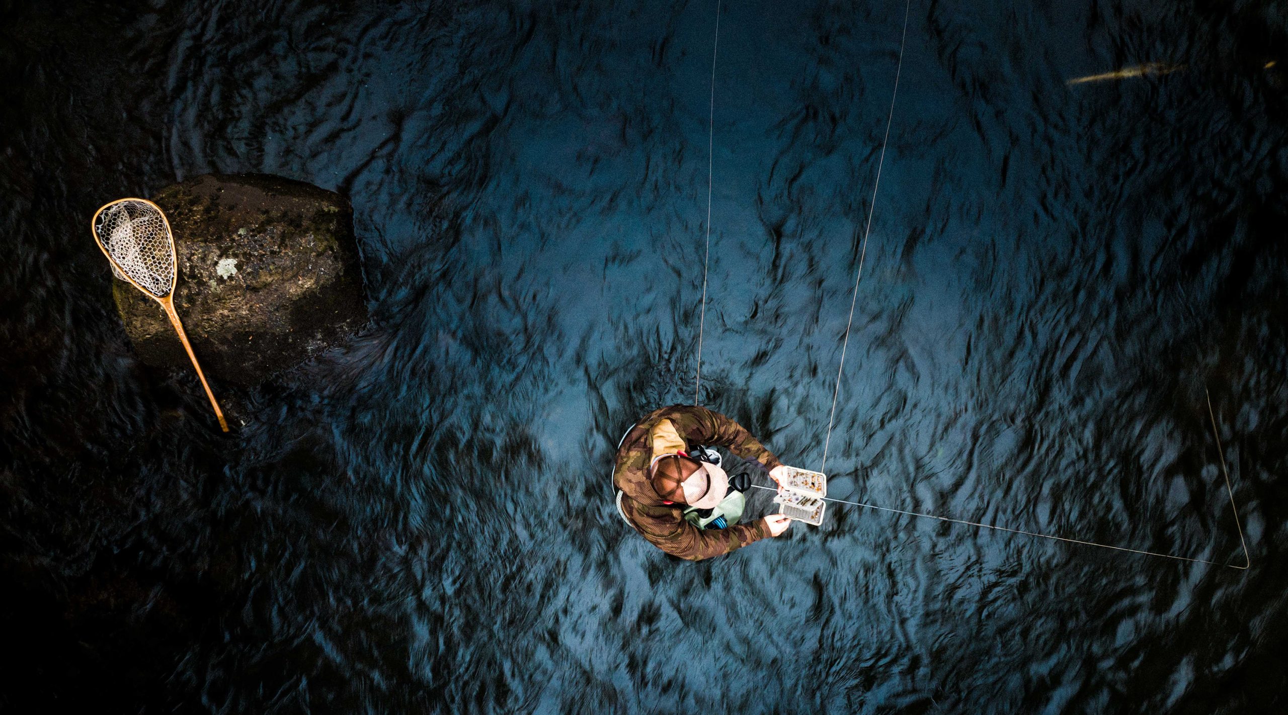 A drone captures Flylords magazine in the water on a fly-fishing trip to Nemacolin.