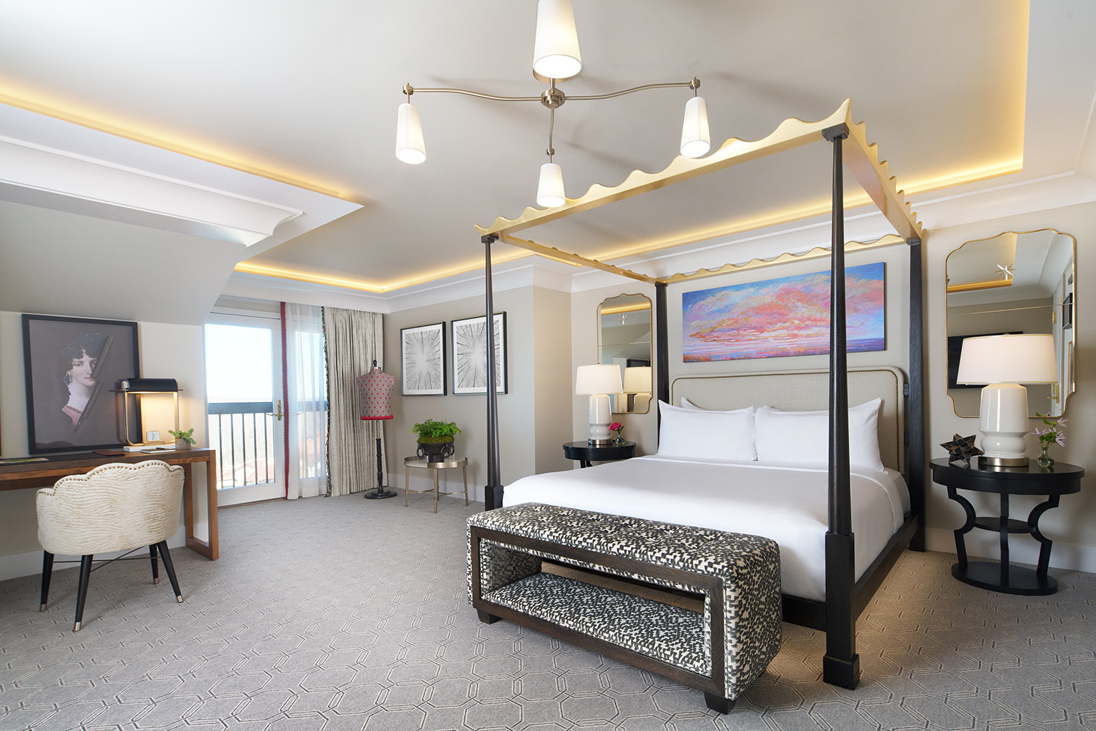 A spacious, bright hotel bedroom featuring a modern four-poster bed with plush linens, stylish lighting fixtures, and chic décor, creating a comfortable and inviting ambiance for relaxation.