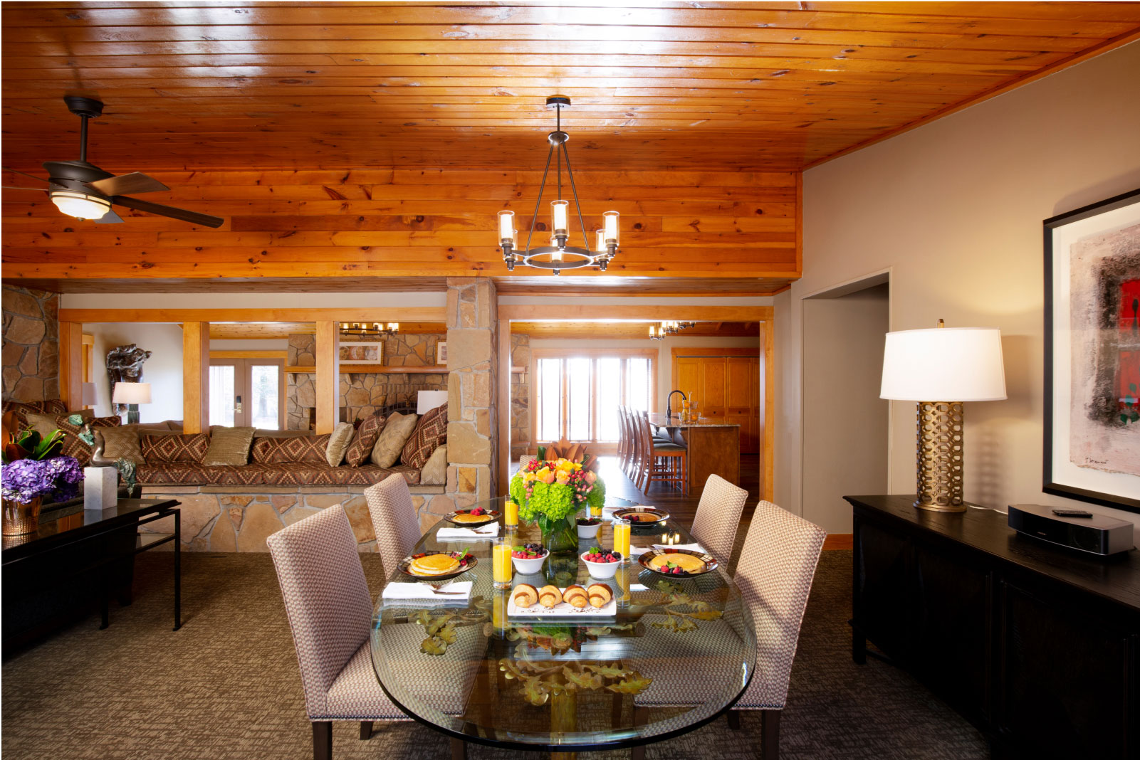 Dining Room table has glass table and gray chairs