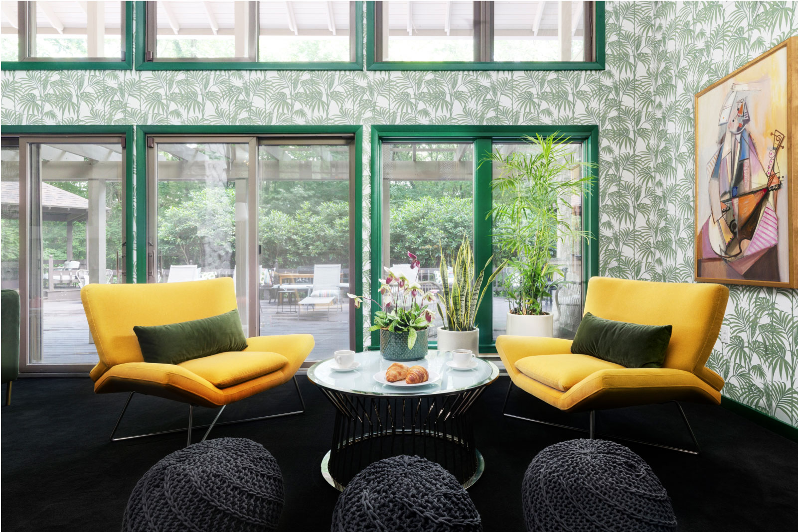 Two yellow chairs and the green detailing on the walls