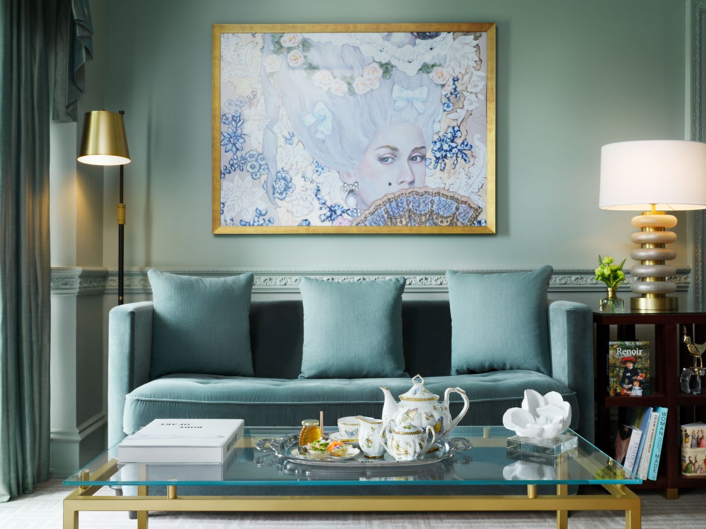 A sophisticated green living room with plush seating and elegant decor, creating a serene atmosphere for relaxation.