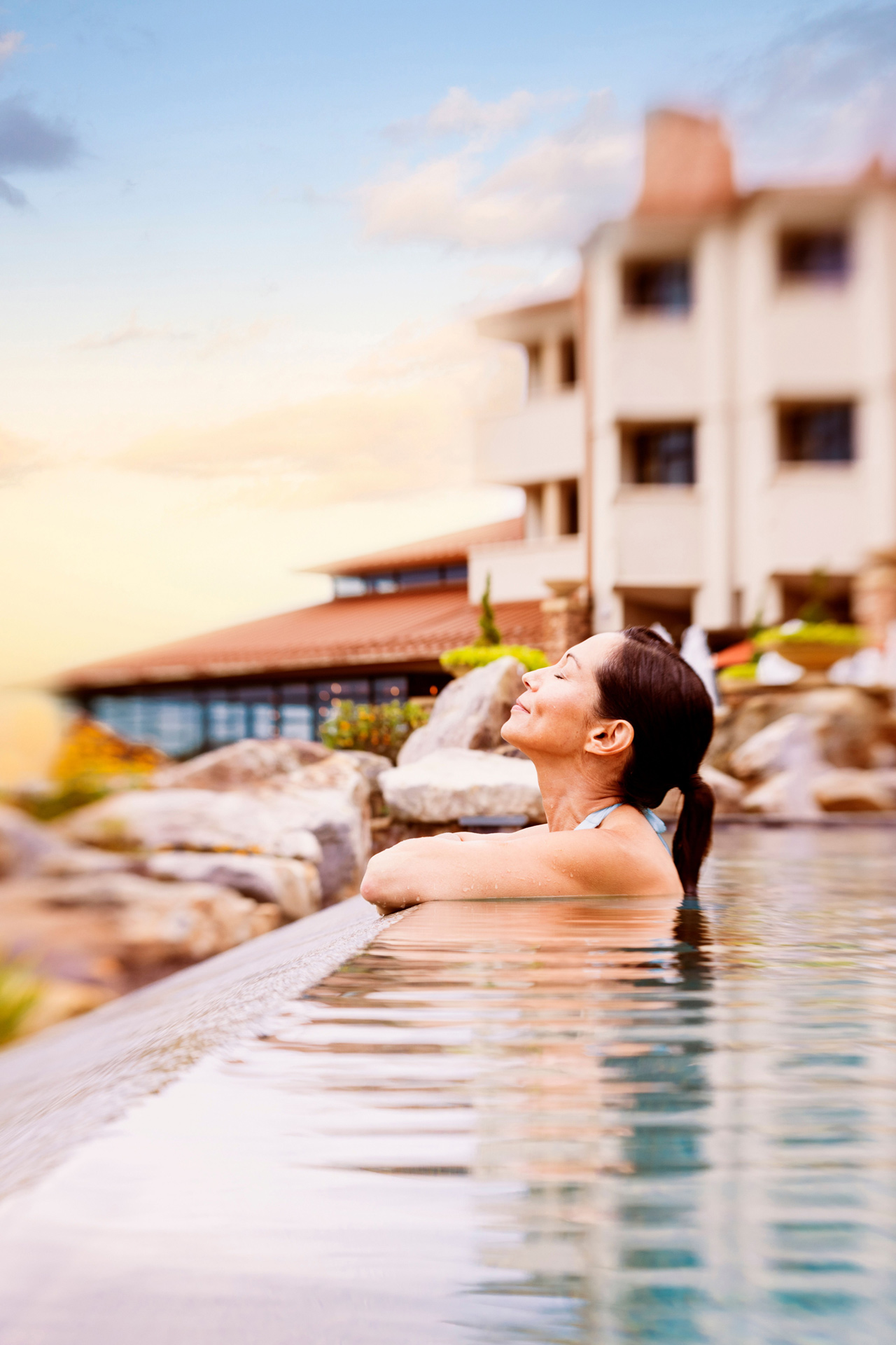 Open gallery overlay: woman in an infinity pool