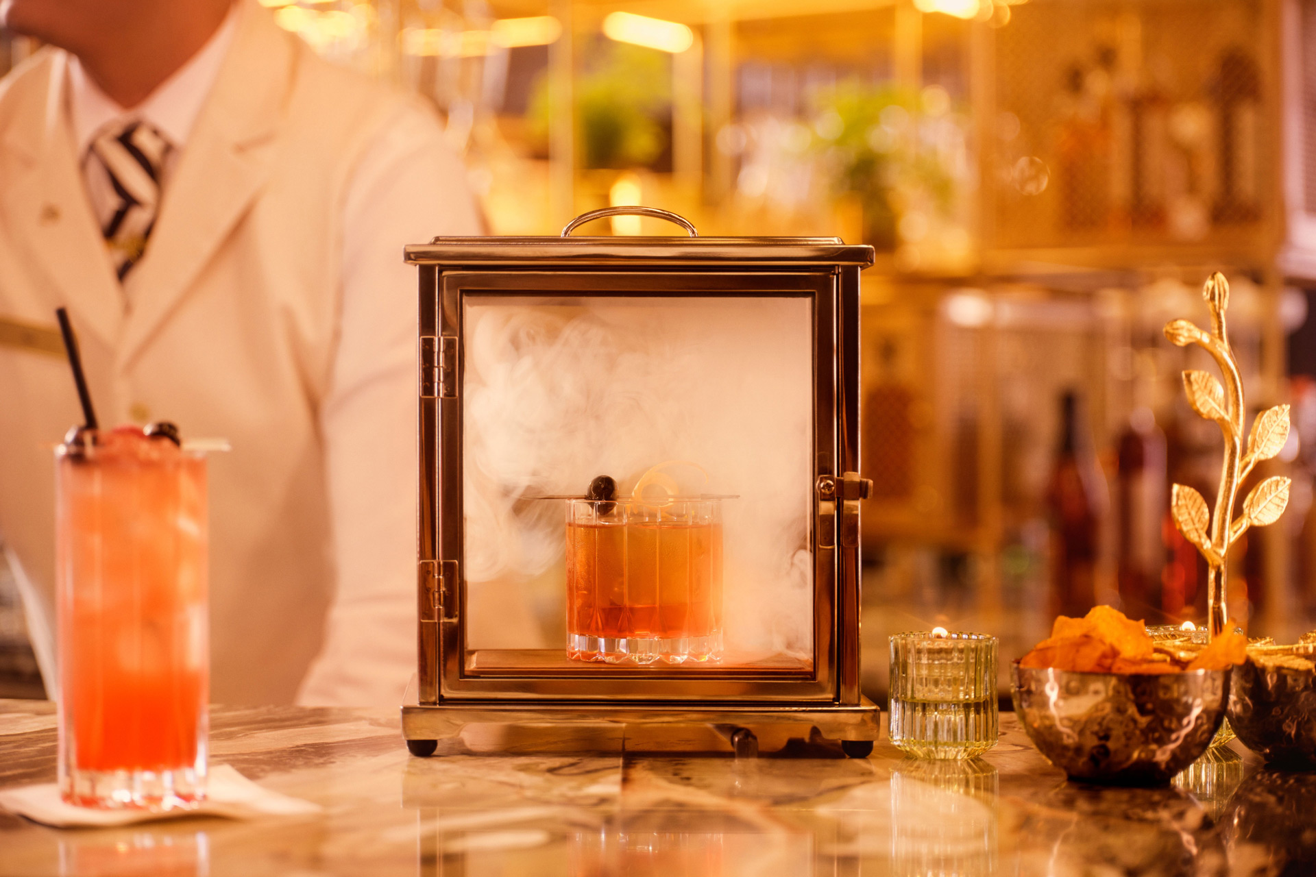 Open gallery overlay: decorative image of cocktails being served