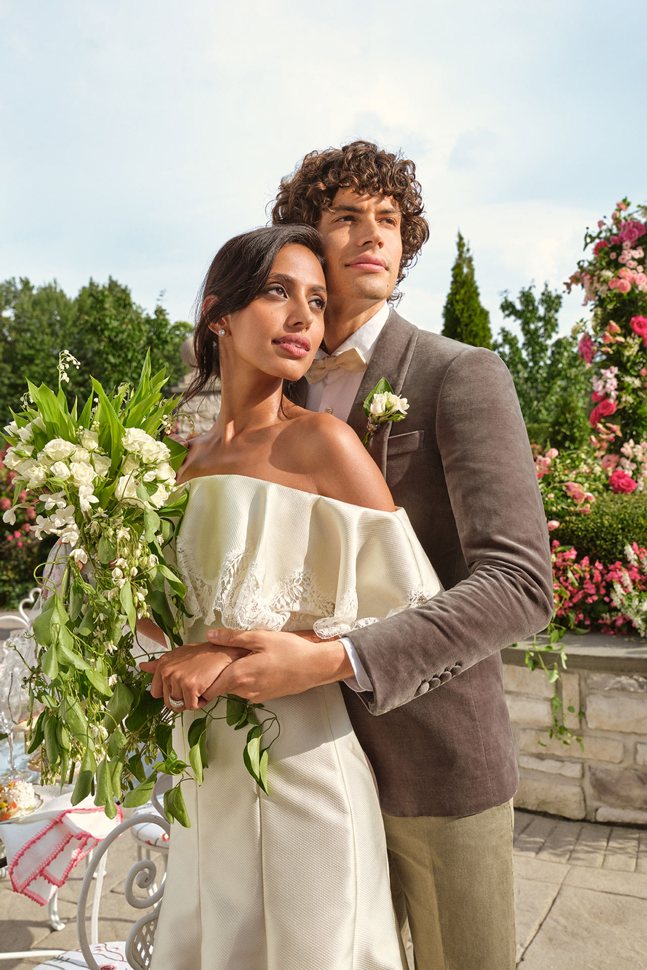 Open gallery overlay: image of woman in white dress and man in suit