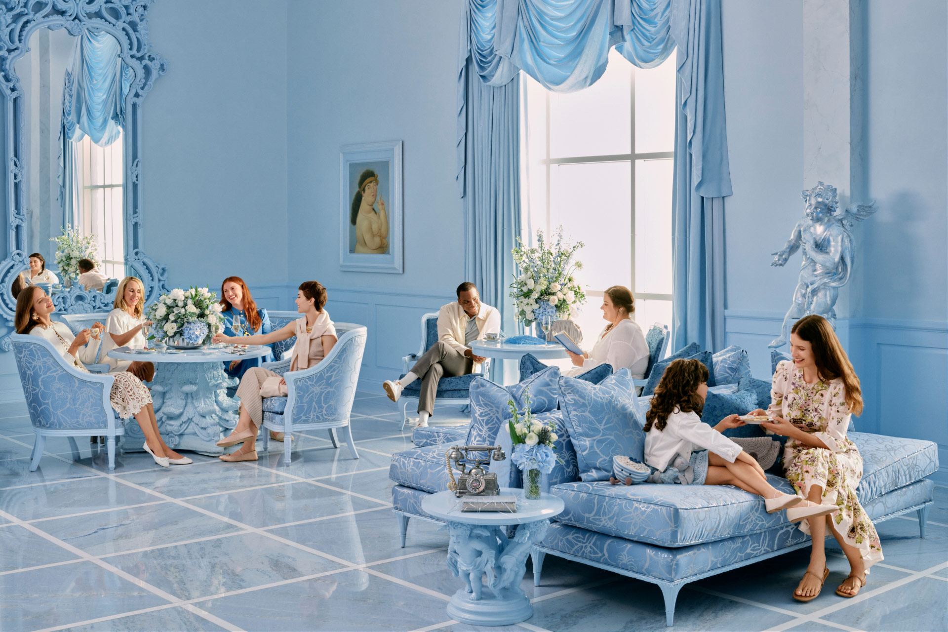 Open gallery overlay: people enjoying food and drink in a blue dining room