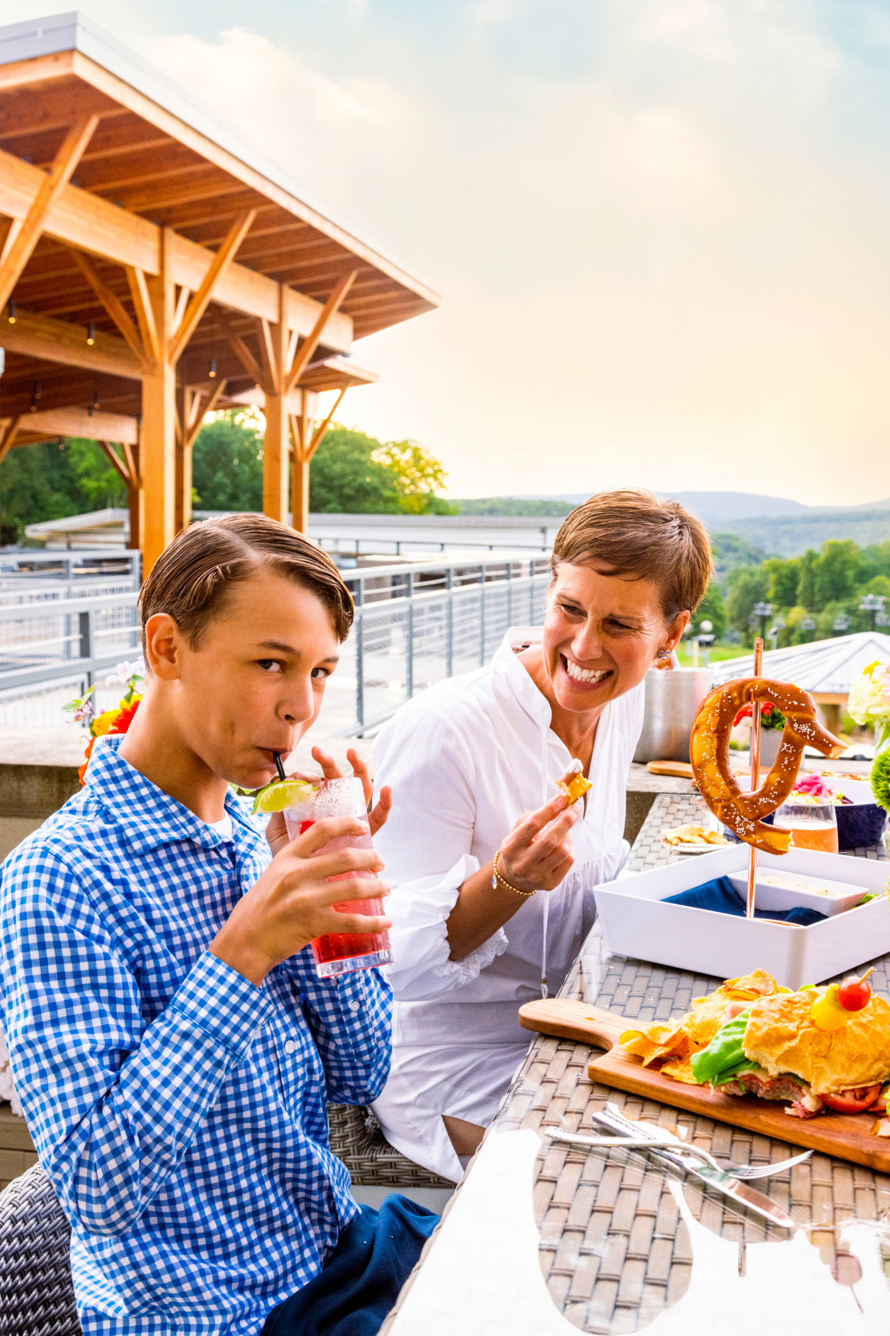 Open gallery overlay: people enjoying a meal and sipping on a drink